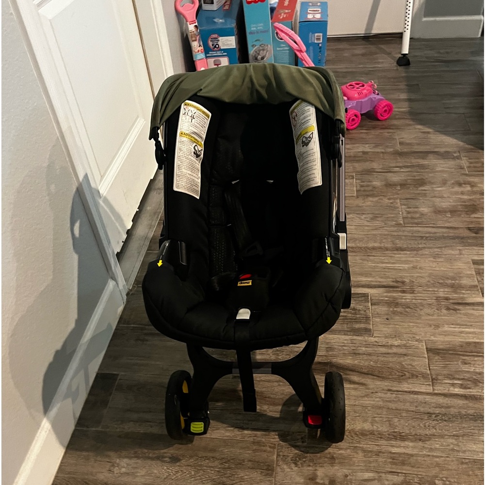 Green Doona stroller